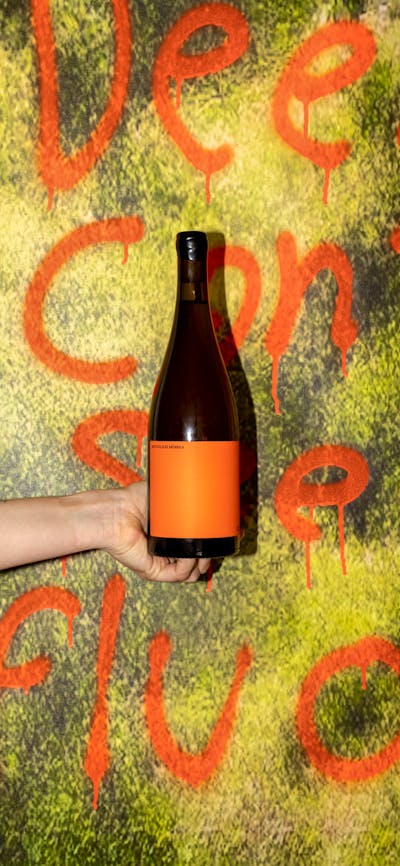 wine bottle over artowrk