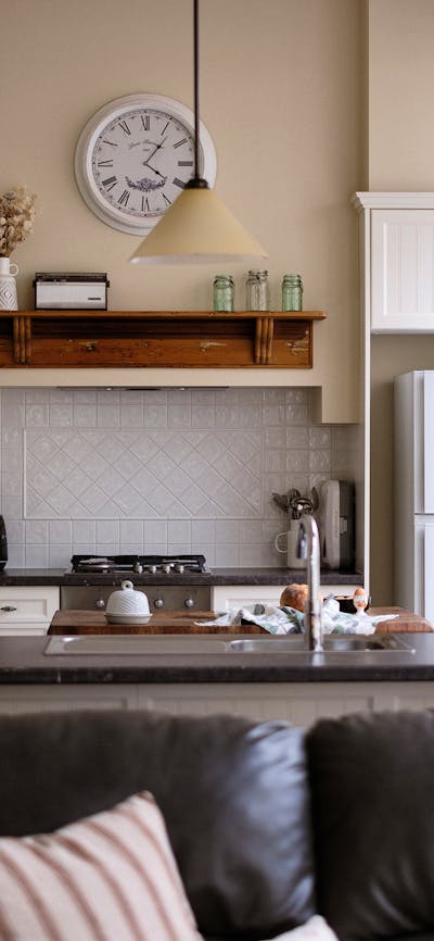 Lounge room looking into a kitchen