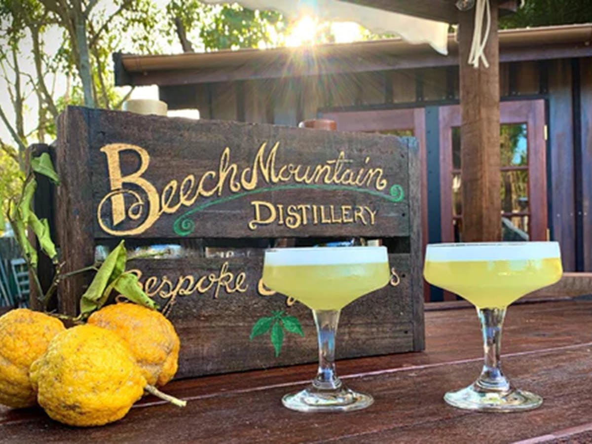 two Lemon Myrtle cocktails, a bunch of lemons and a crate reading "Bespoke & Fabulous"
