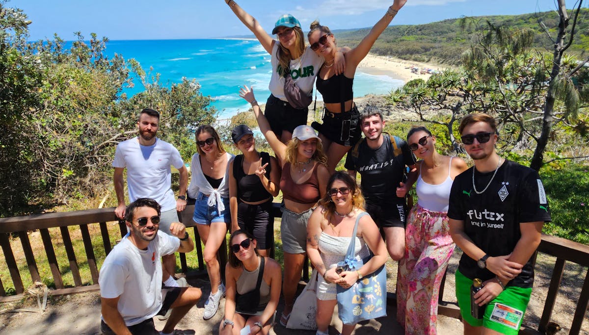 Group of international travellers on the North Gorge Walk at Point Lookout, Stradbroke Island.