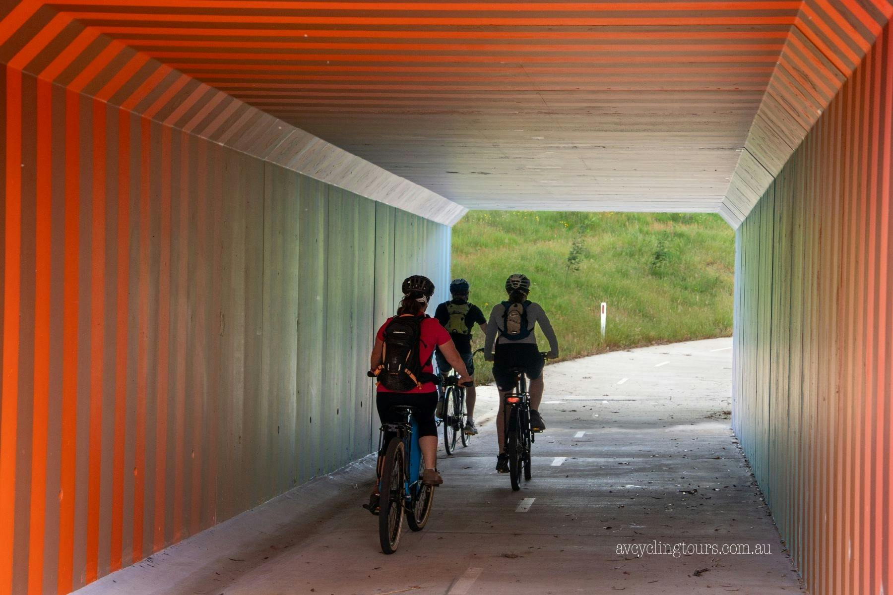 cyclists in railtrail tunnel