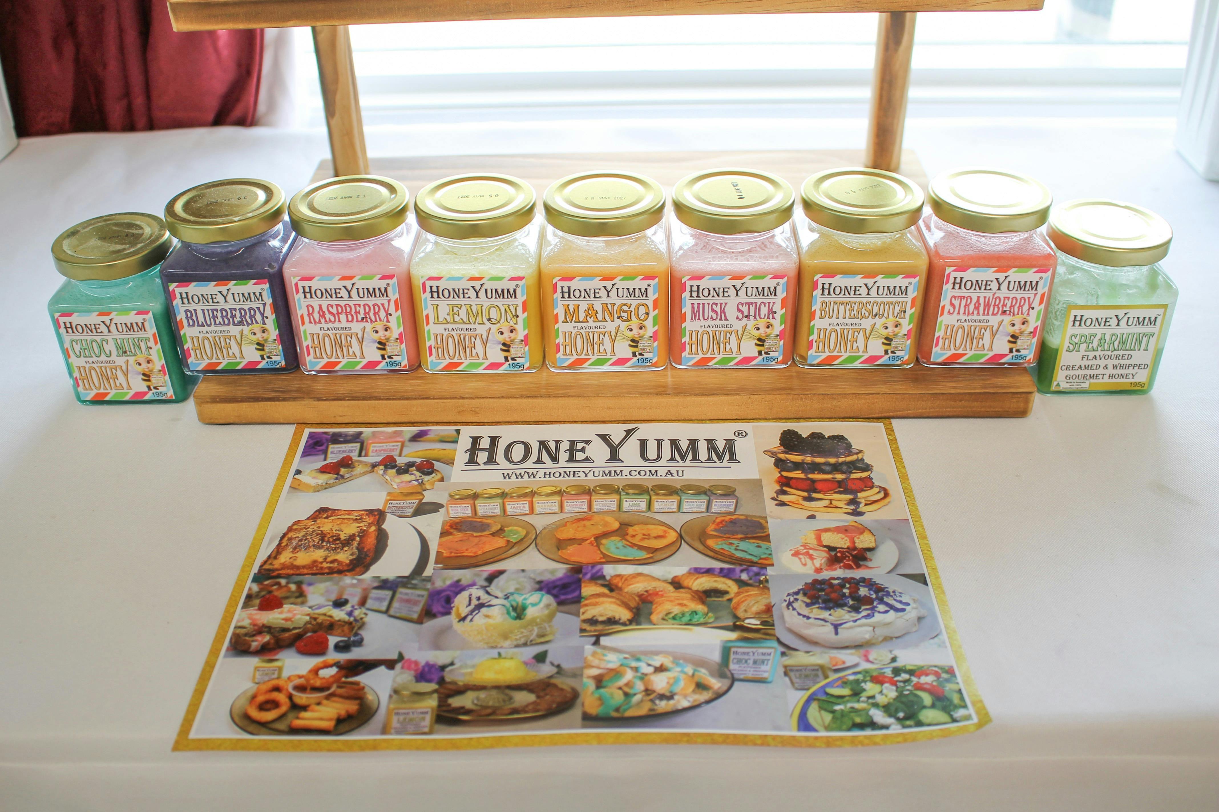 Jars of flavoured and coloured honey.