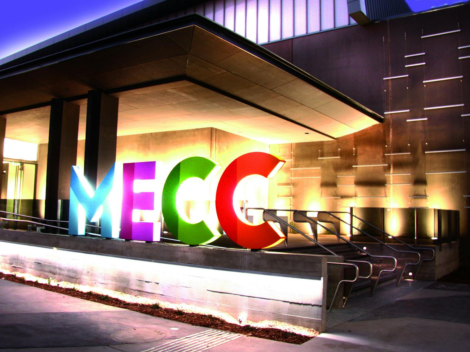 The MECC logo outside the front entrance of the MECC building