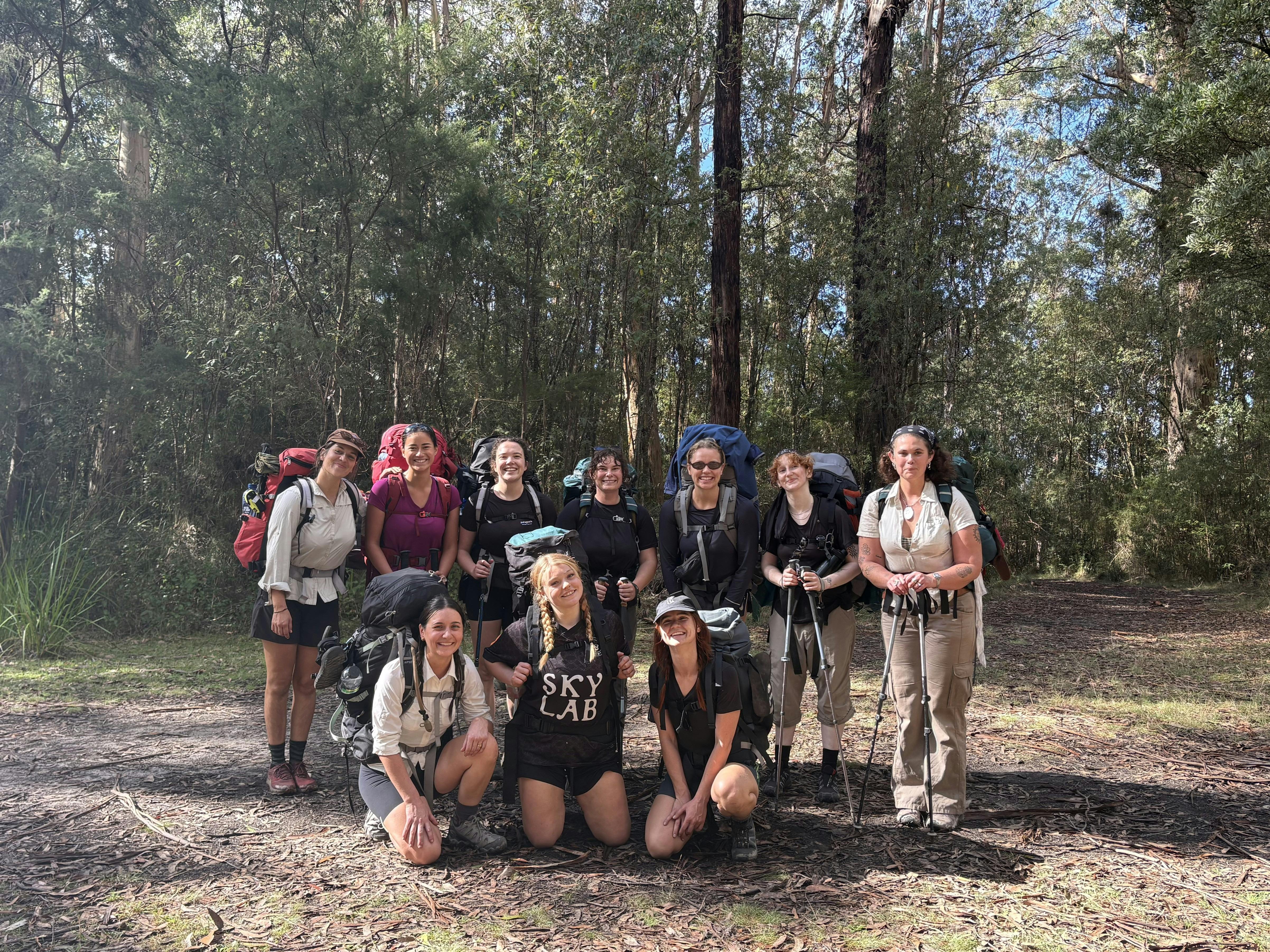 group of women with the australian bush behind them