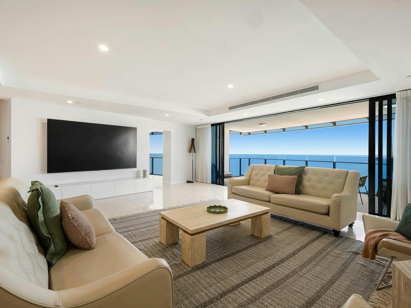 Main living room with ocean views, huge smart tv and balcony - Gold Coast Holidays Soul Peppers Main living room with ocean views, huge smart tv and balcony - Gold Coast Holidays Soul Peppers