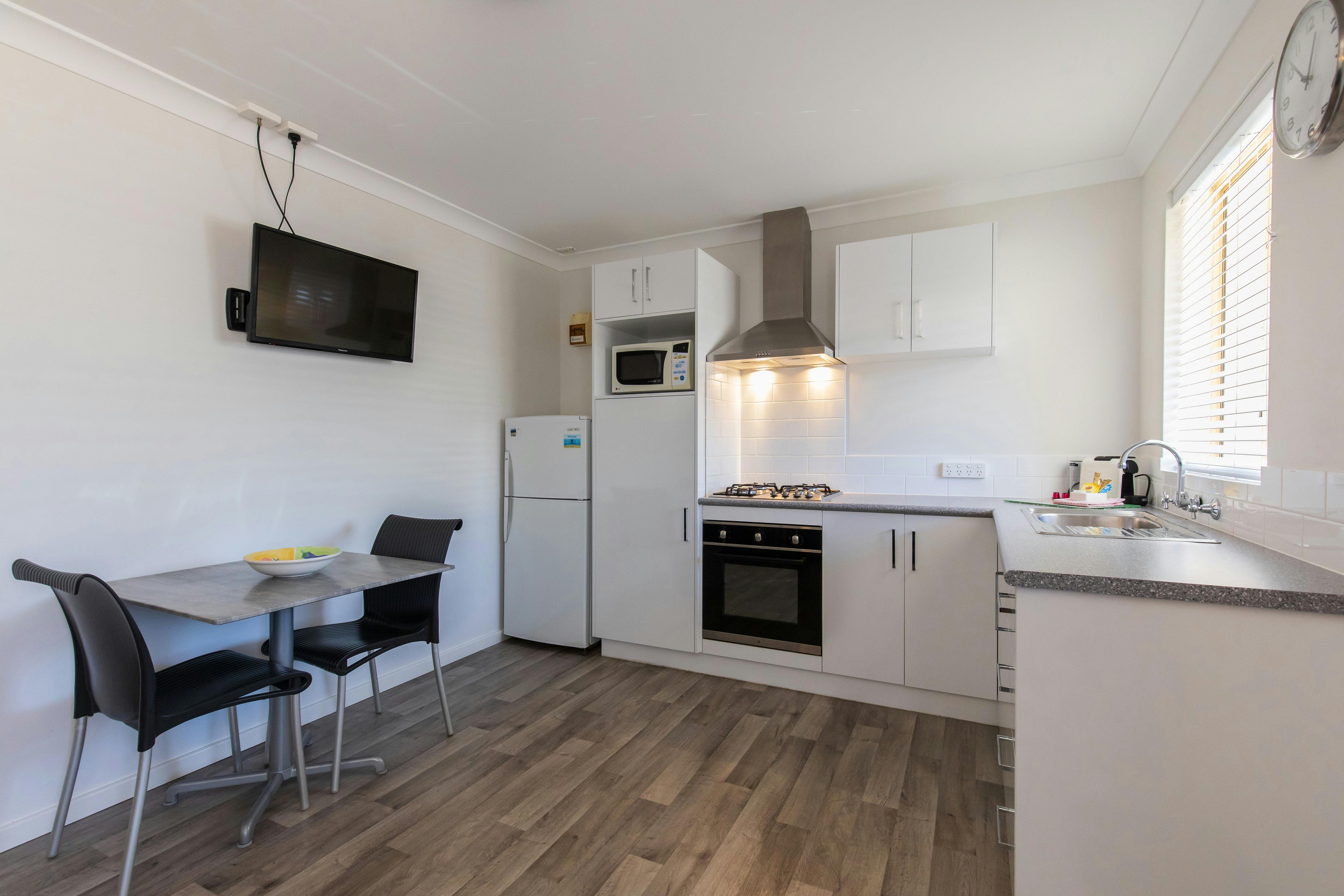 Fully equipped kitchen and dining  in holiday unit at Esperance Bay Holiday Park