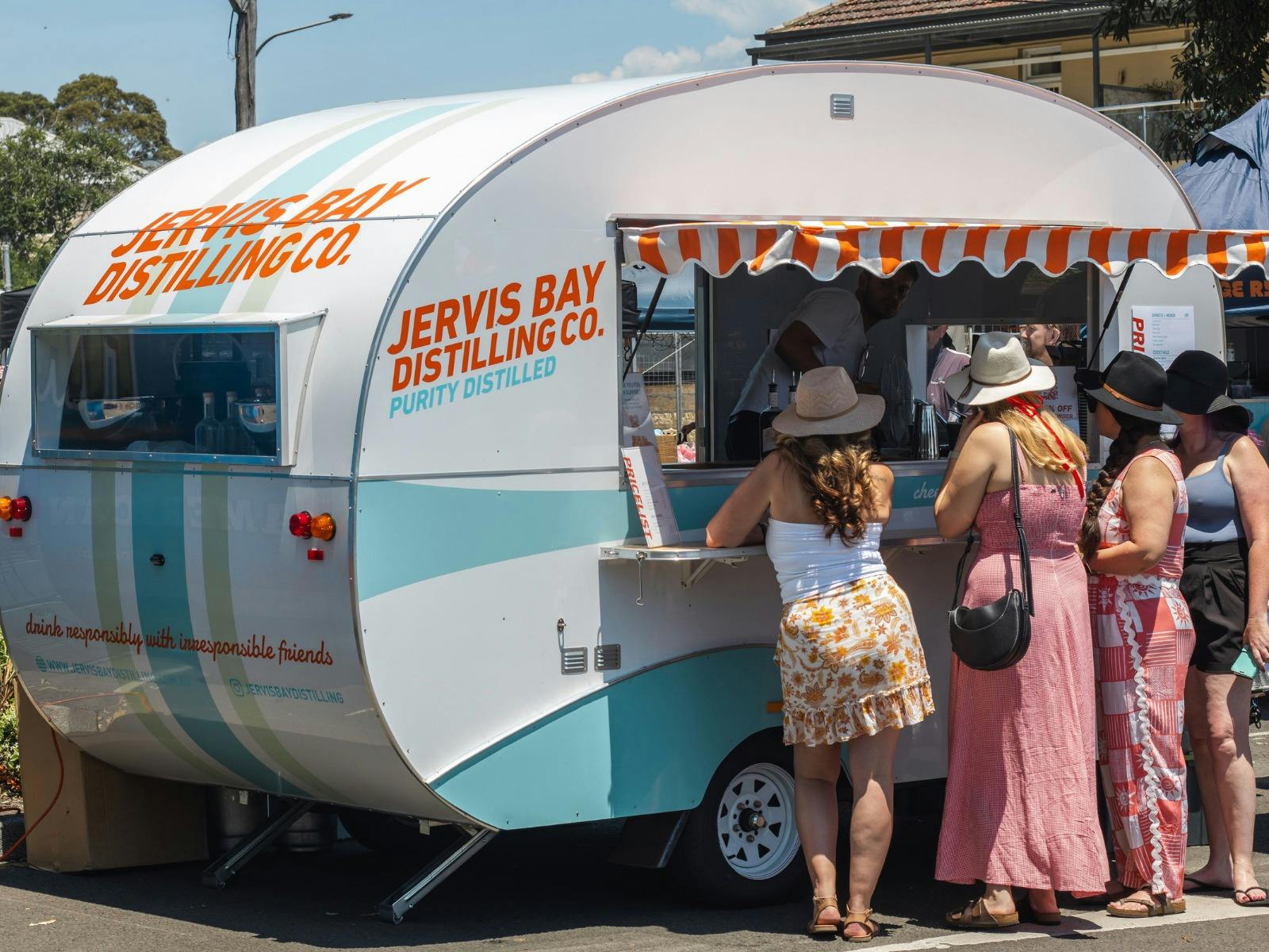 Jervis Bay Distilling Co caravan  serving festival-goers