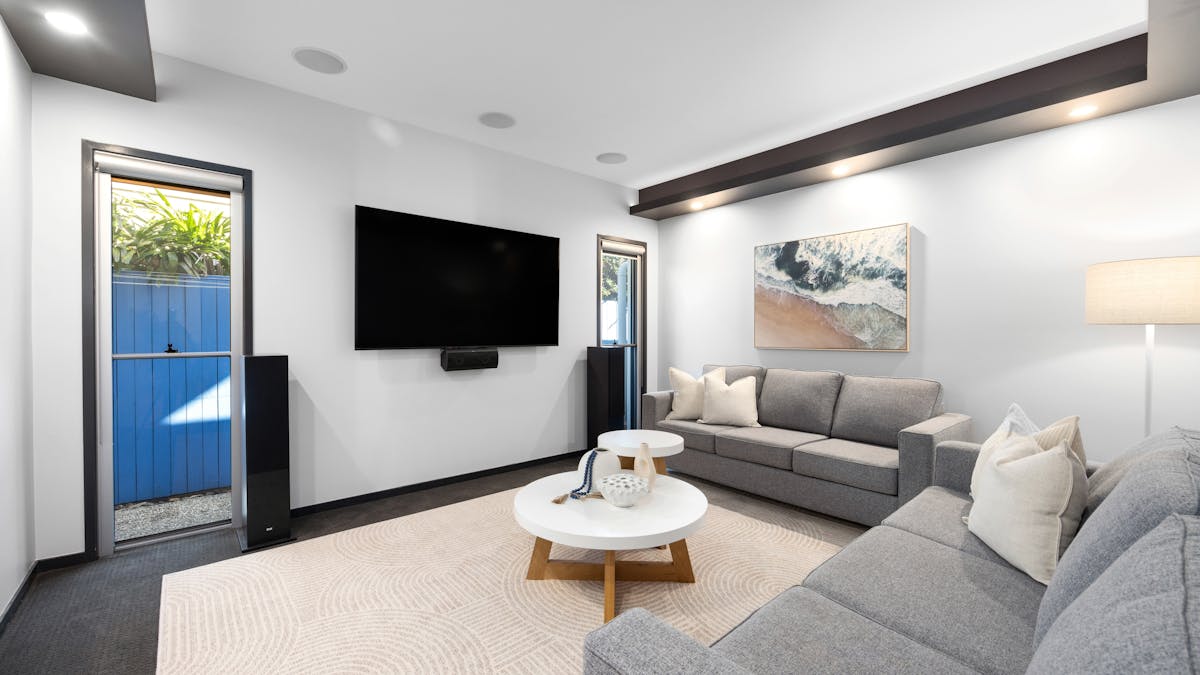 Large media room with smart tv and sofabed