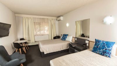 Our classic hotel room is a comfortable sized room with a queen & single bed