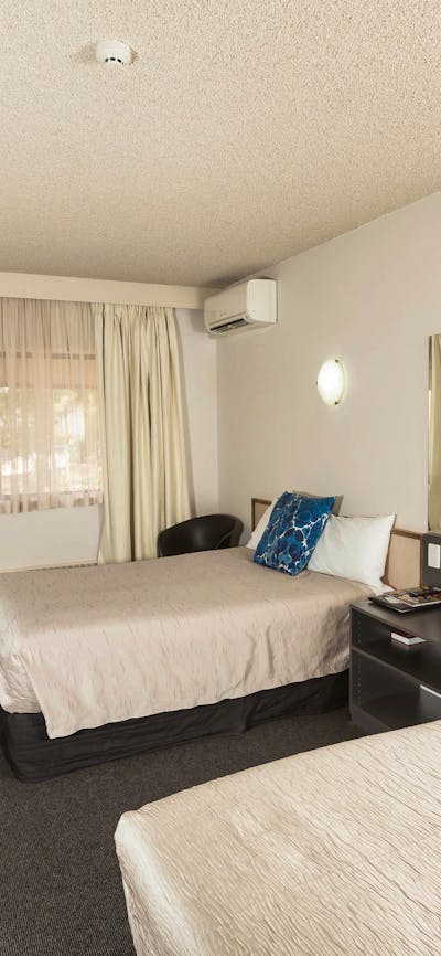 Our classic hotel room is a comfortable sized room with a queen & single bed
