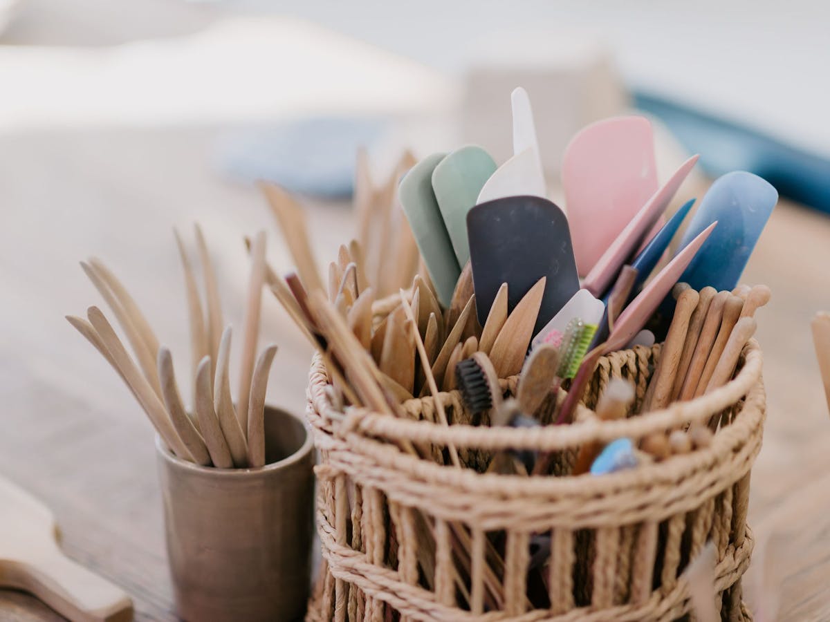 woven container with wooden clay handbuilding tools in it woven container with wooden clay handbuilding tools in it