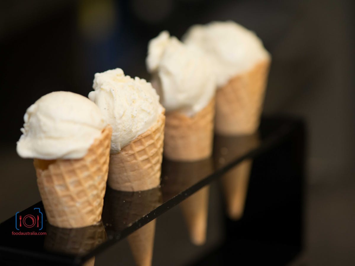 ice cream in cones positioned in a line