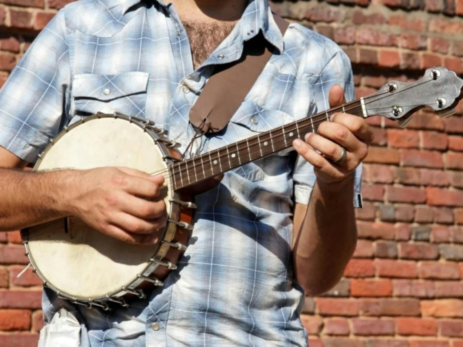 Artist performing with a banjo