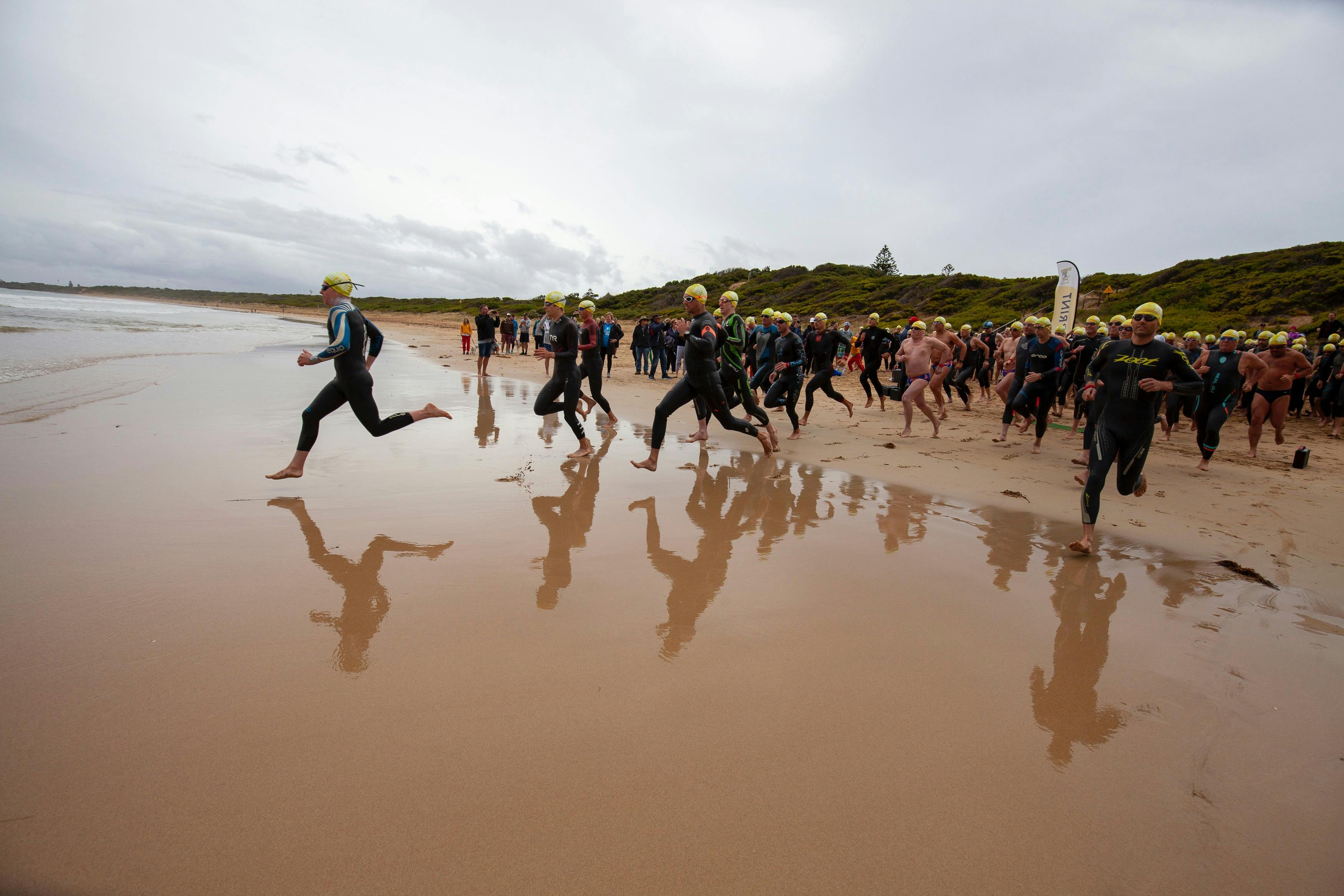 Swimmers entering the water
