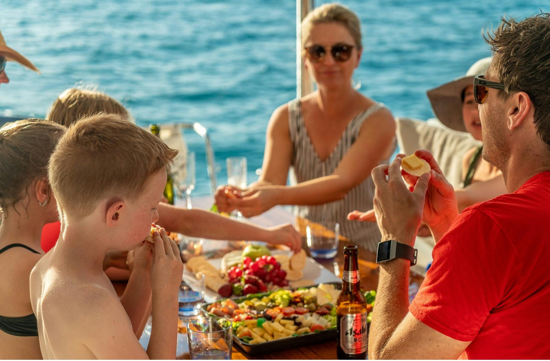 Family eating dinner boat