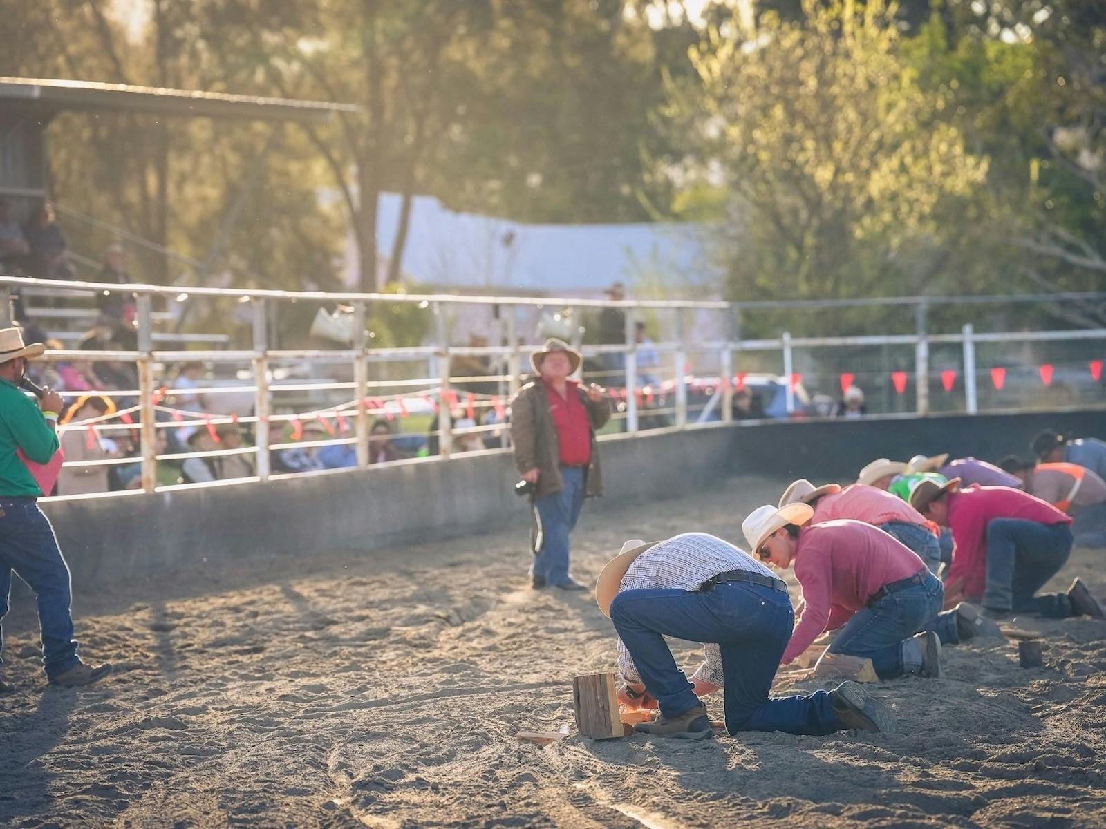 competitors in a race to build a campfire