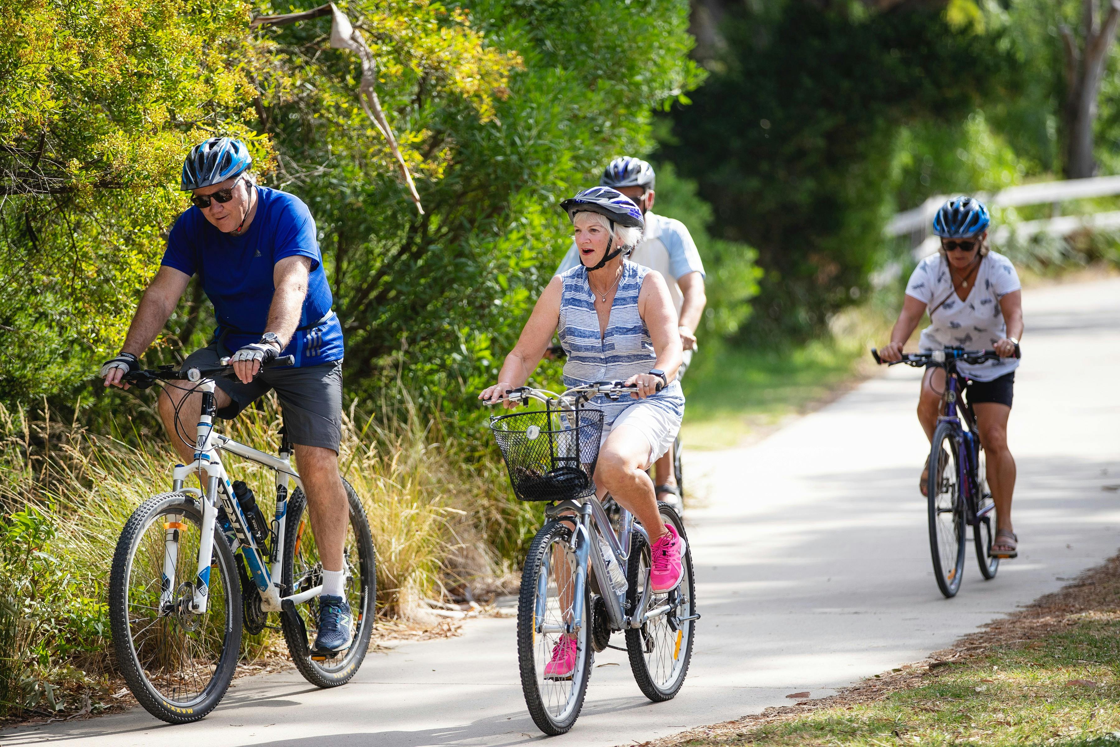 Holiday makers ride bikes