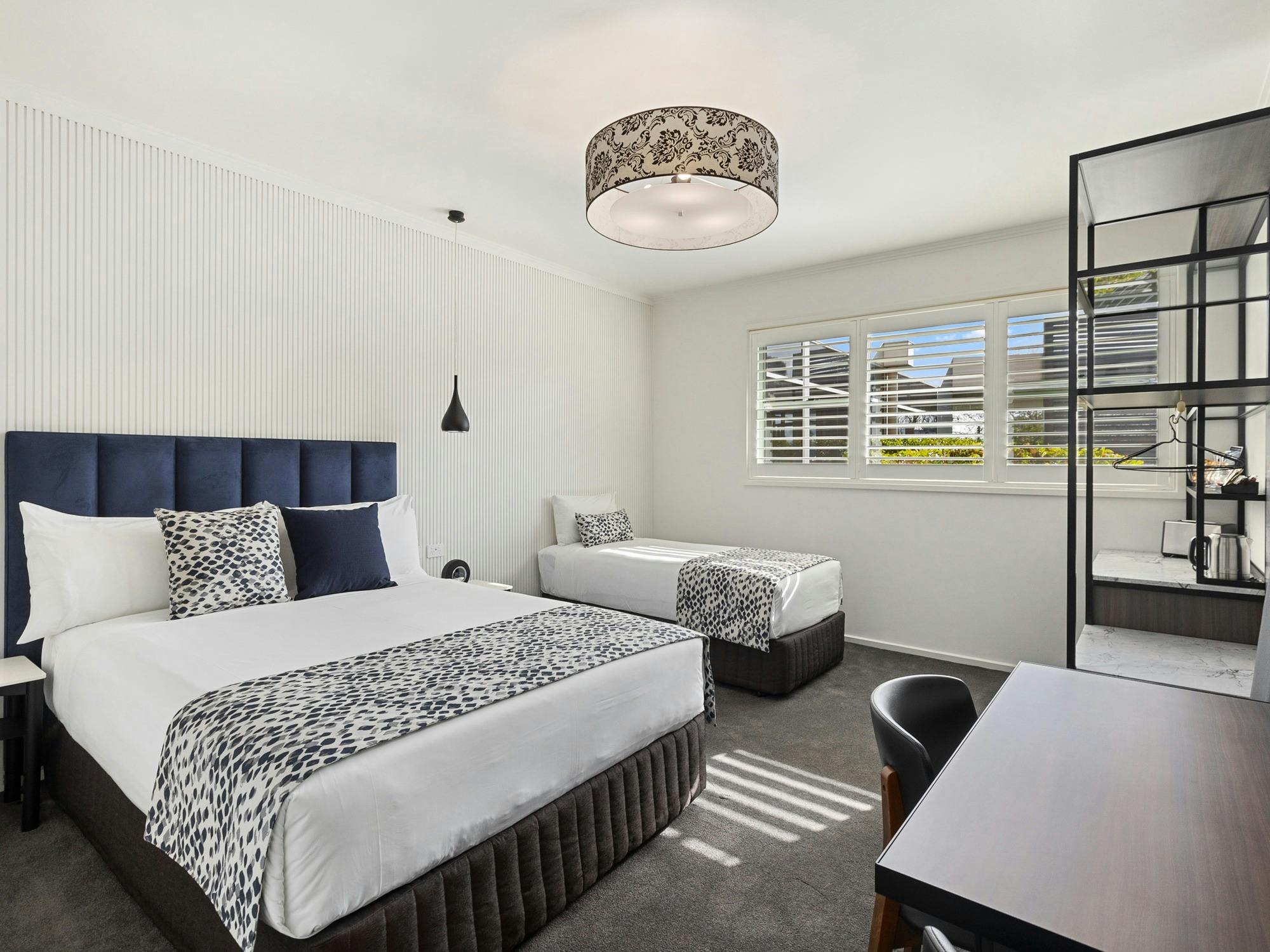 Queen and Single bed showing configuration of access suite layout