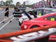 Cars parked up on pit lane garage