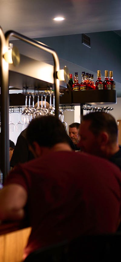 The Tintino kitchen in action, diner seated at the bar