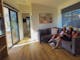 Visitors sitting on a couch in the new deluxe cabin