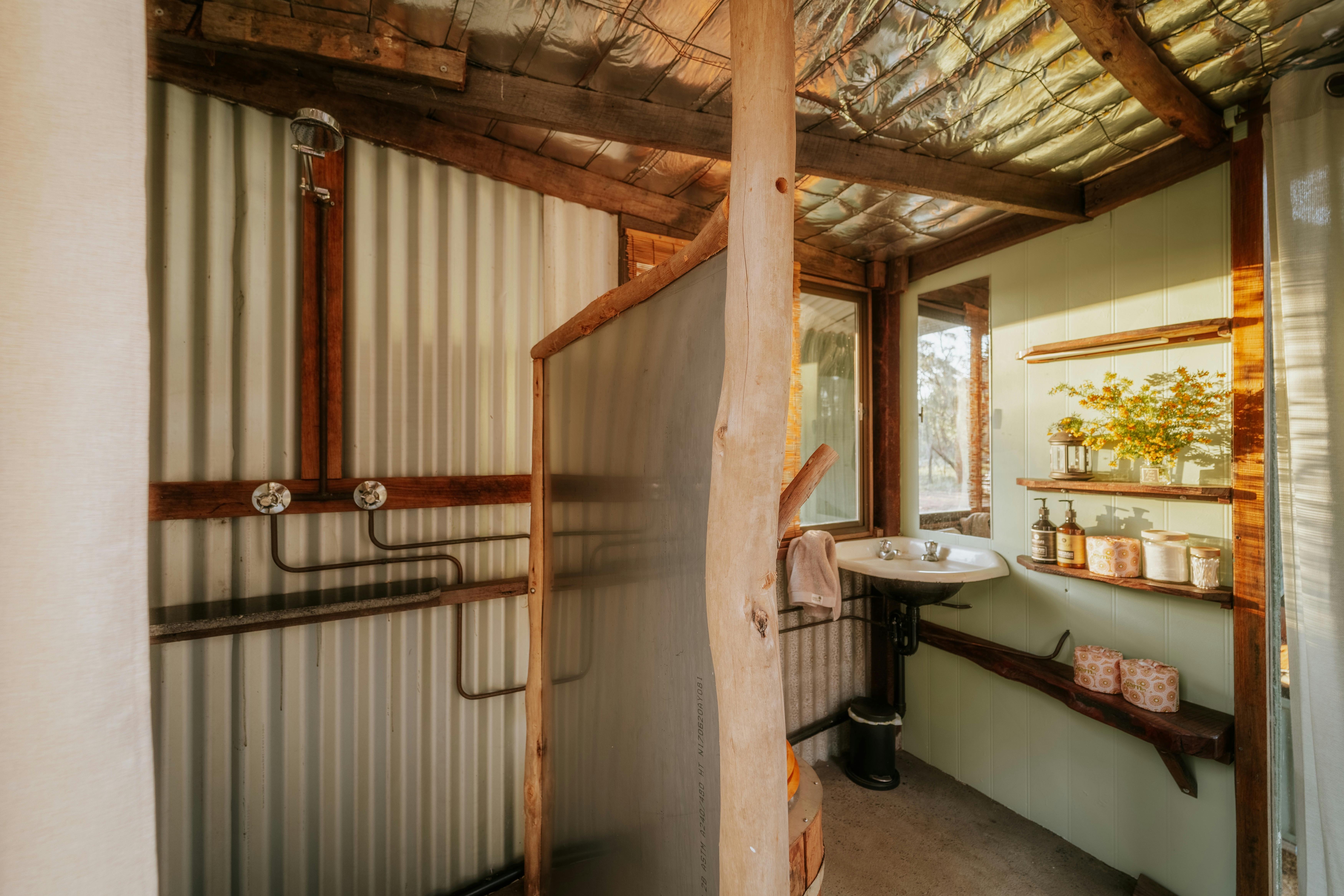 Shared bathroom area equipment with shower, compatible toilet and basin.