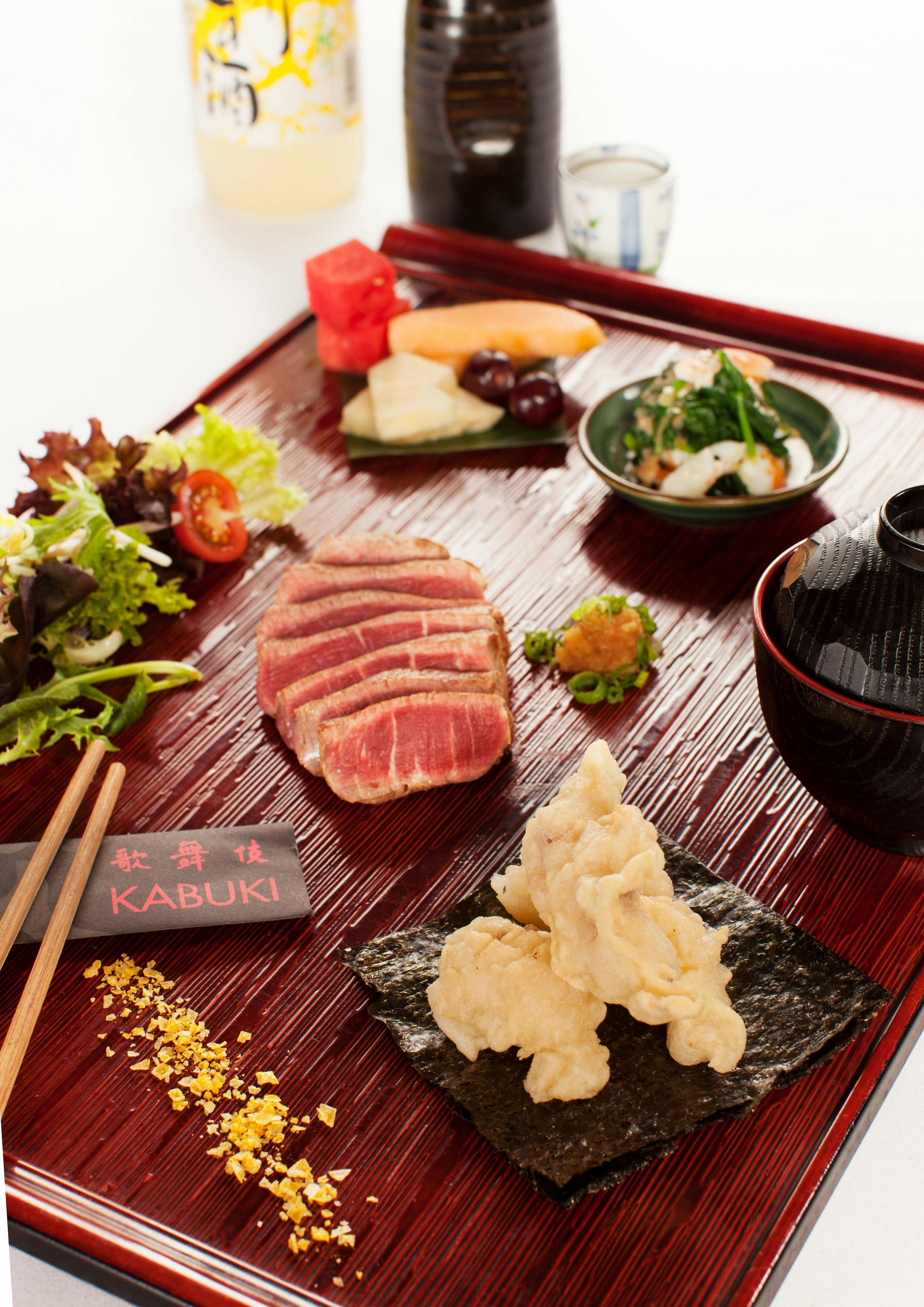 Kabuki food laid out on a plate with wagyu beef in the middle