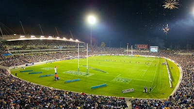 A packed stadium at night