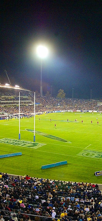 A packed stadium at night