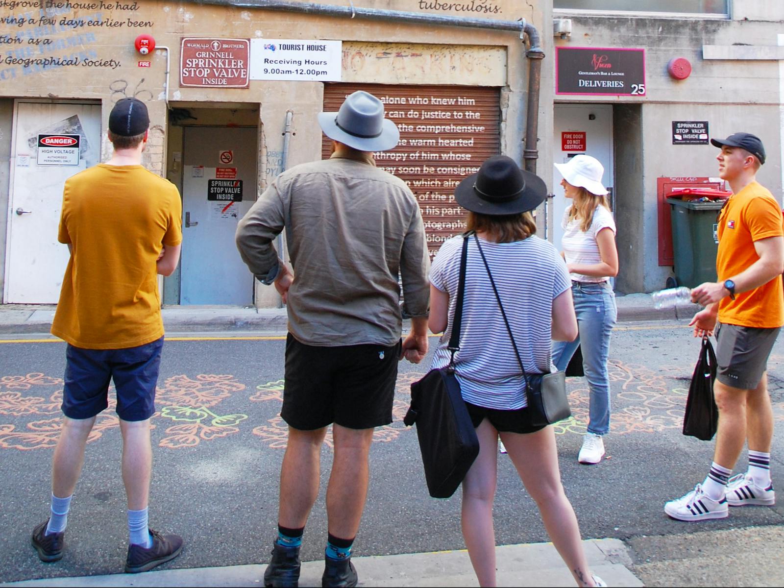 Five people in a city lane way Five people in a city lane way