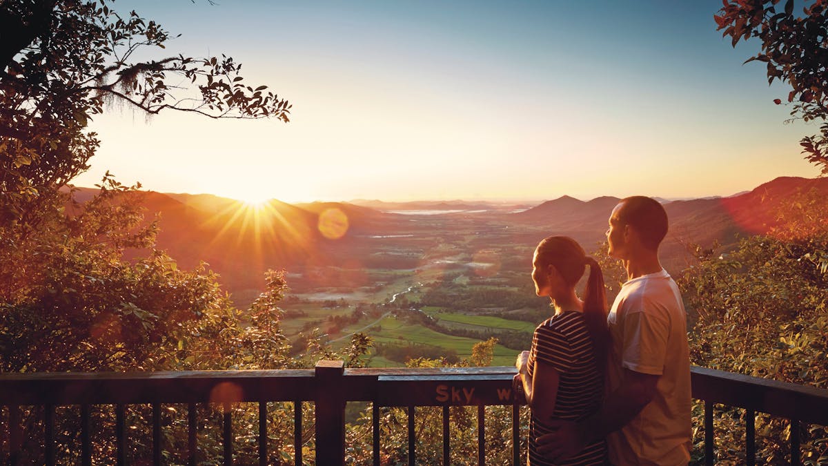 Couple at Sky Window lookout with Pioneer Valley view.