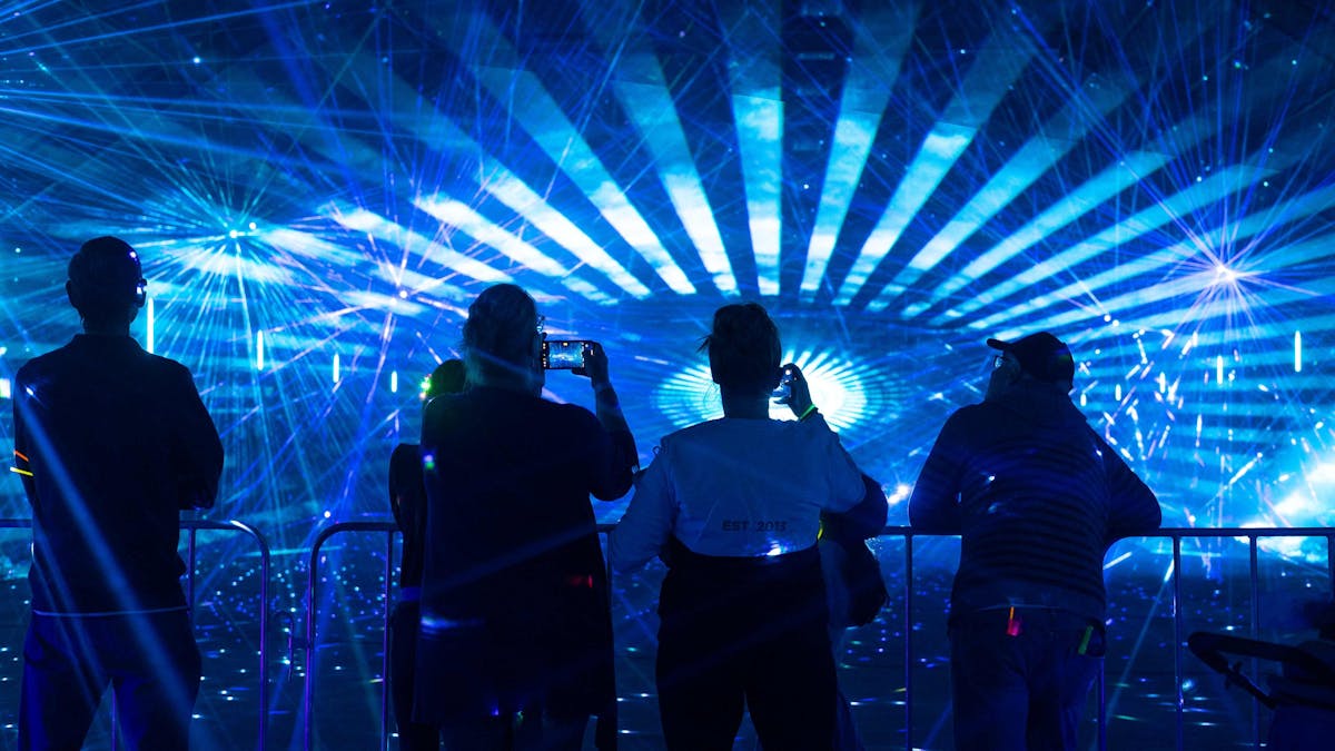 Group of people watching the laser light show