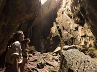 A park ranger and woman tour through Royal Arch Cave in Chillagoe, Tropical North QLD.