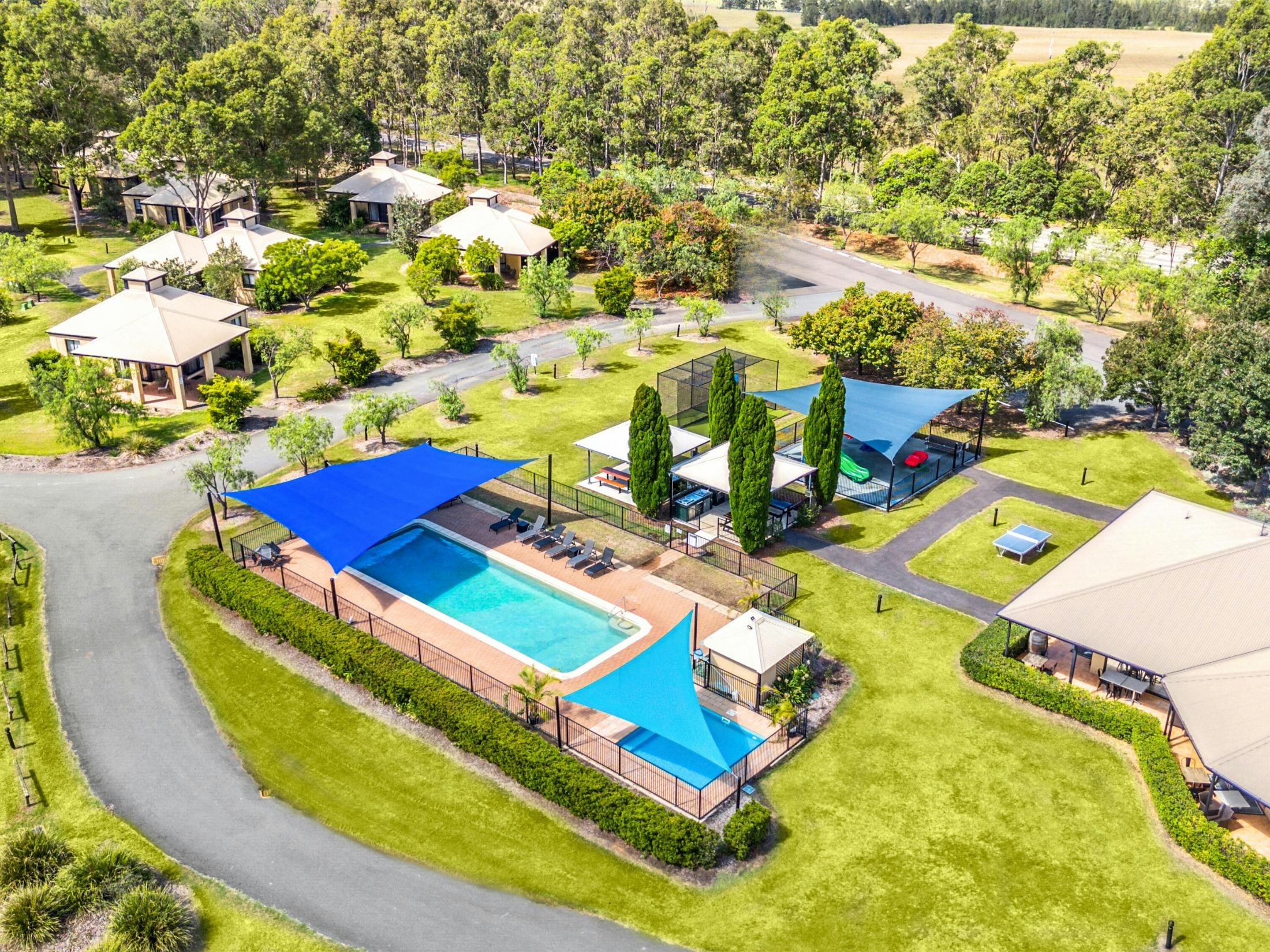 Aerial view of resort showing villas, pool and recreational facilities