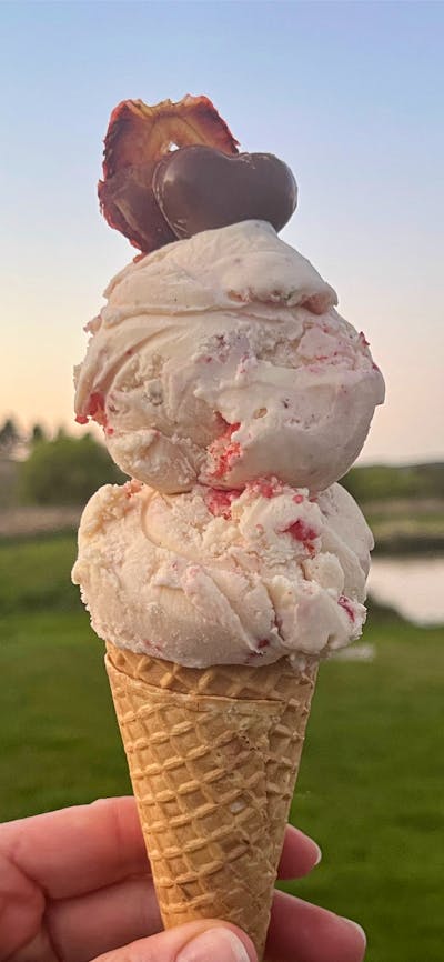 An ice-cream come with a sunset background