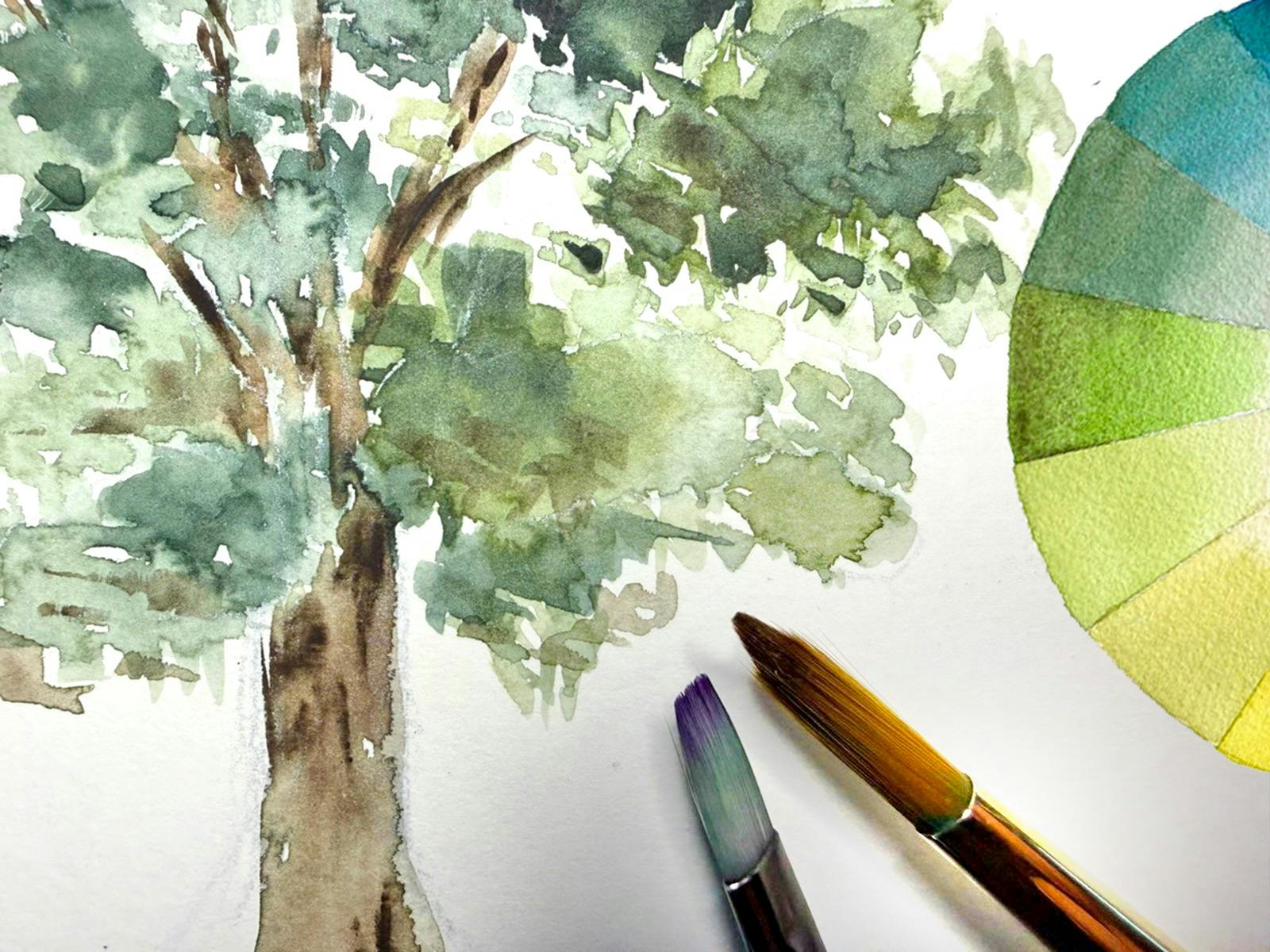 A watercolour painting of a eucalupt tree, next to brushes and a colour wheel
