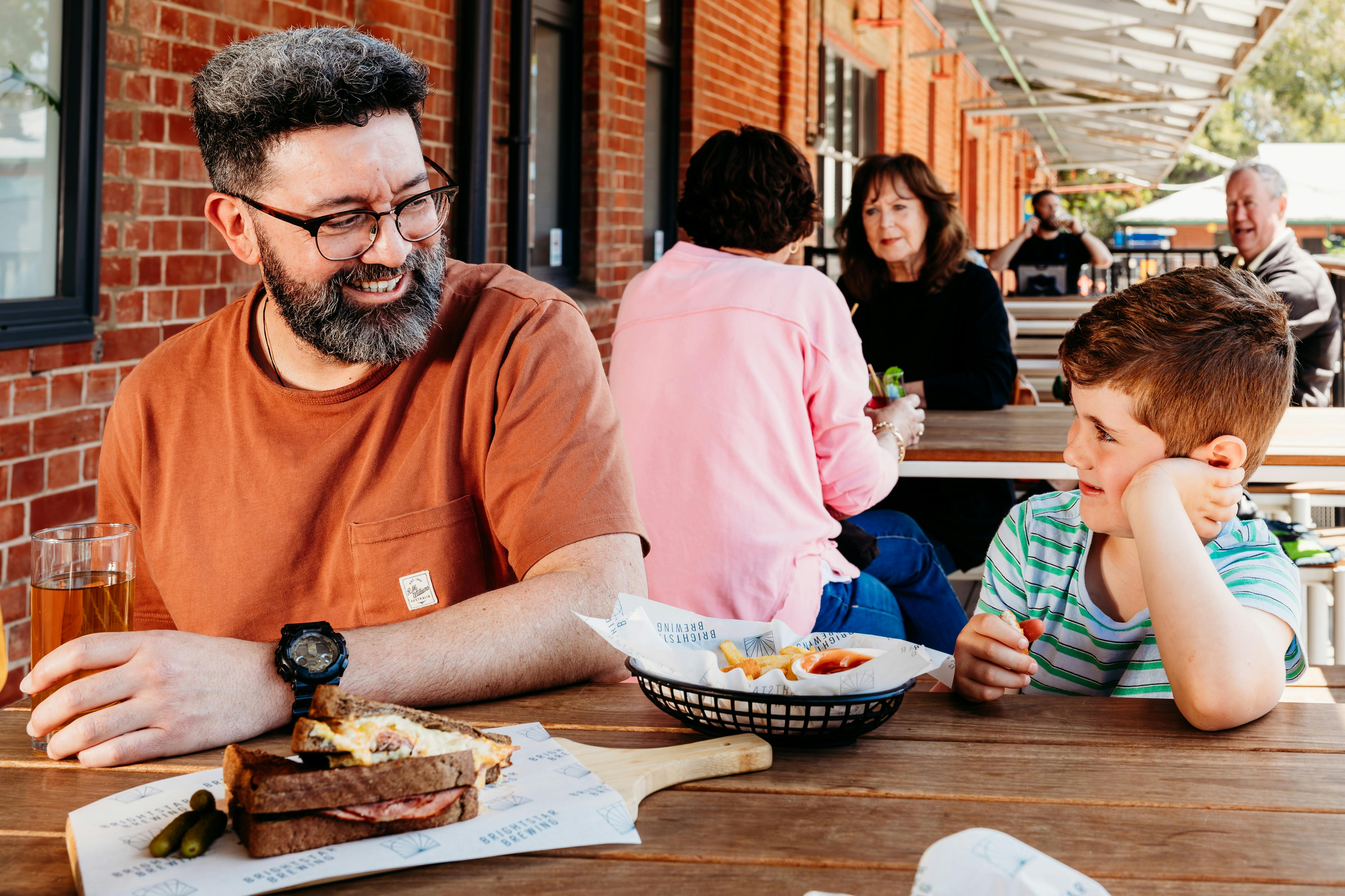 Boy and Father sitting on a deck