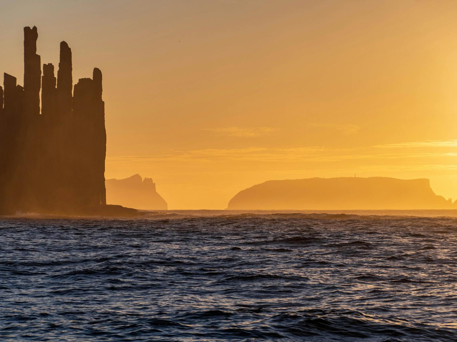 Sunset at sea looking back from the Lady Nelson to the South Eastern shoreline