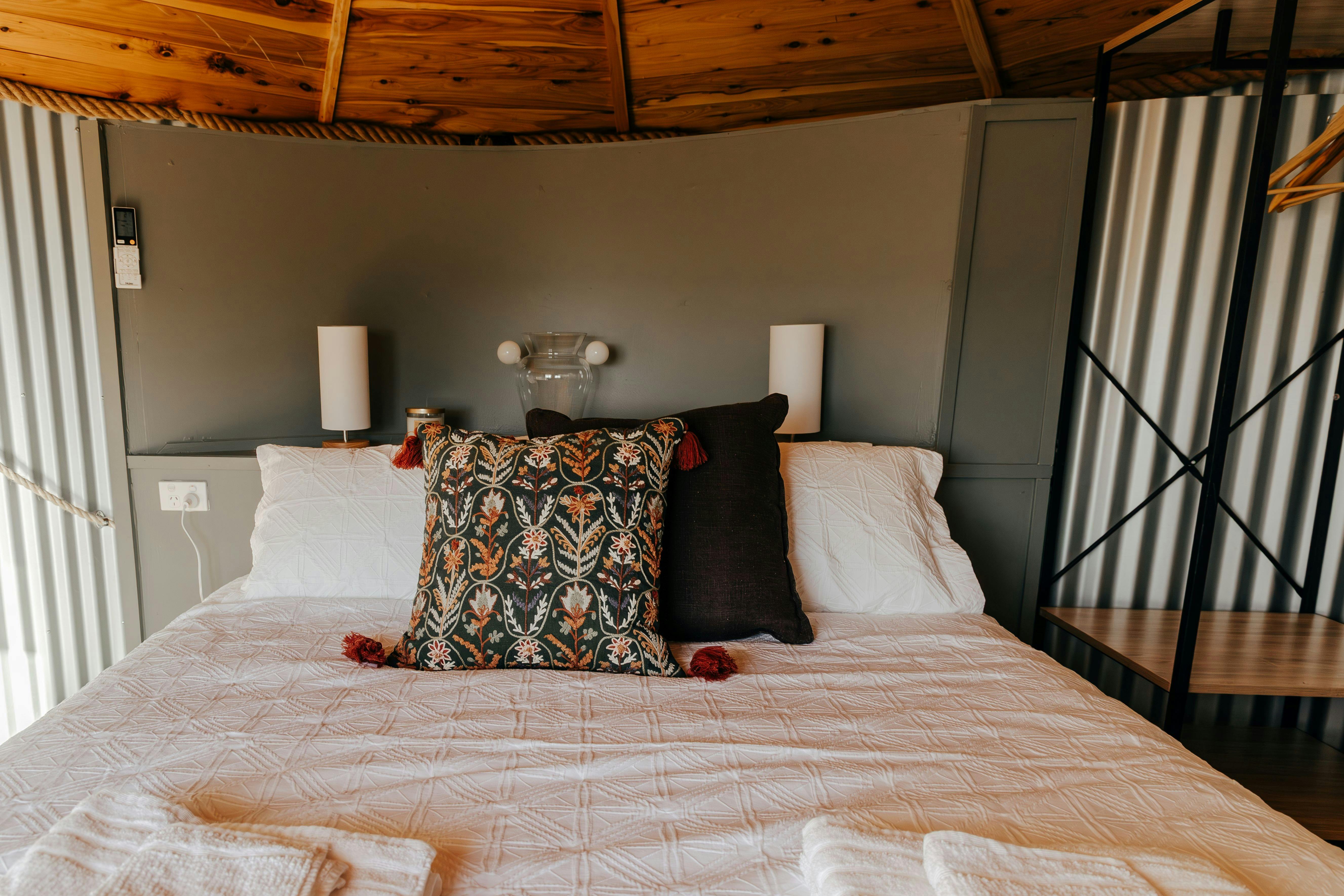 The main bedroom upstairs has a queen bed fitted with luxurious bamboo/cotton  sheets