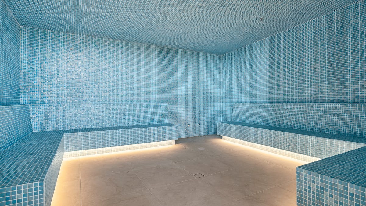 Relaxing steam room offering a tranquil space to unwind and rejuvenate after a workout or long day.