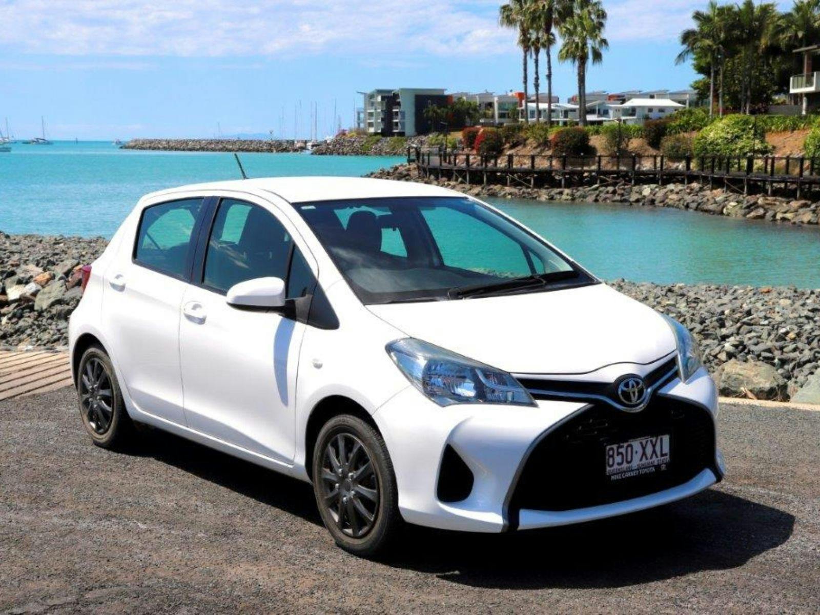 Small 5-seater car for hire with beach backdrop