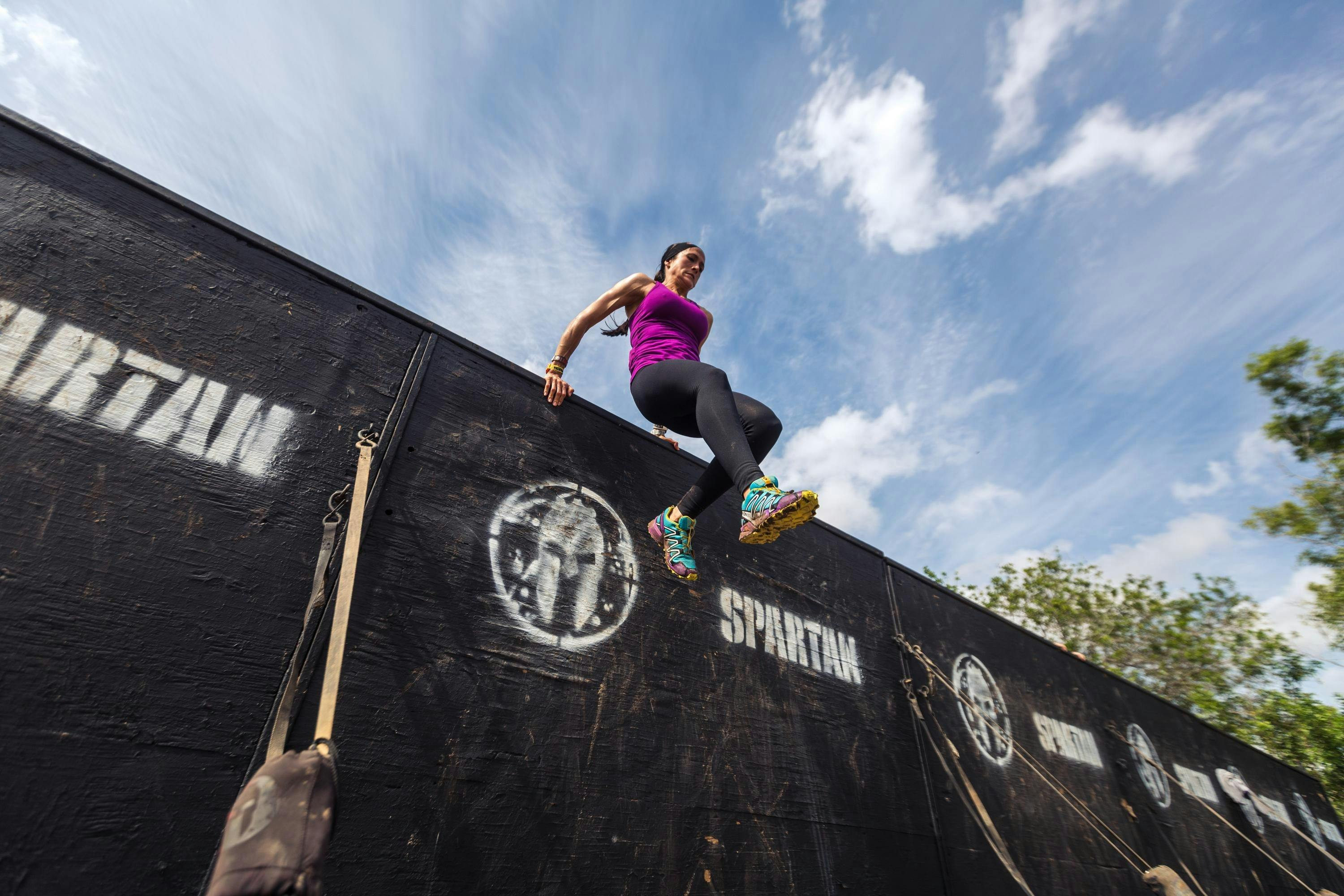 A person competes in Spartan Race.