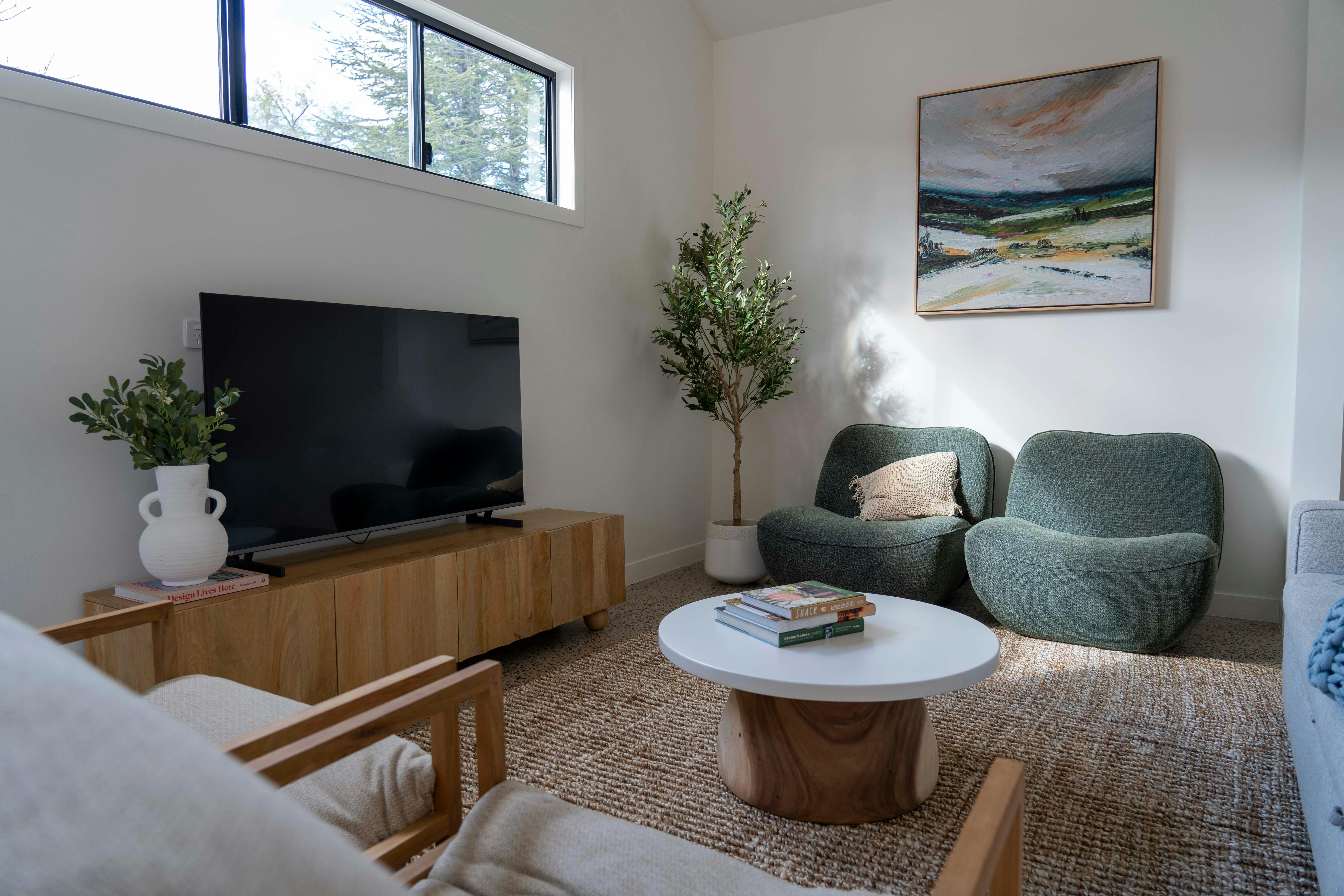 The Living Room is a beautiful space with artwork and designer furnishings