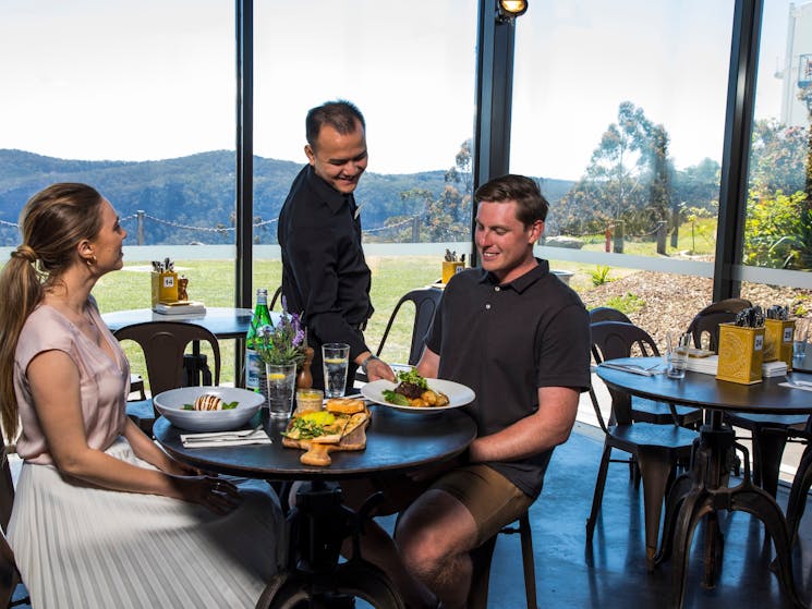 Couple enjoying food and drink at the Boiler House Cafe