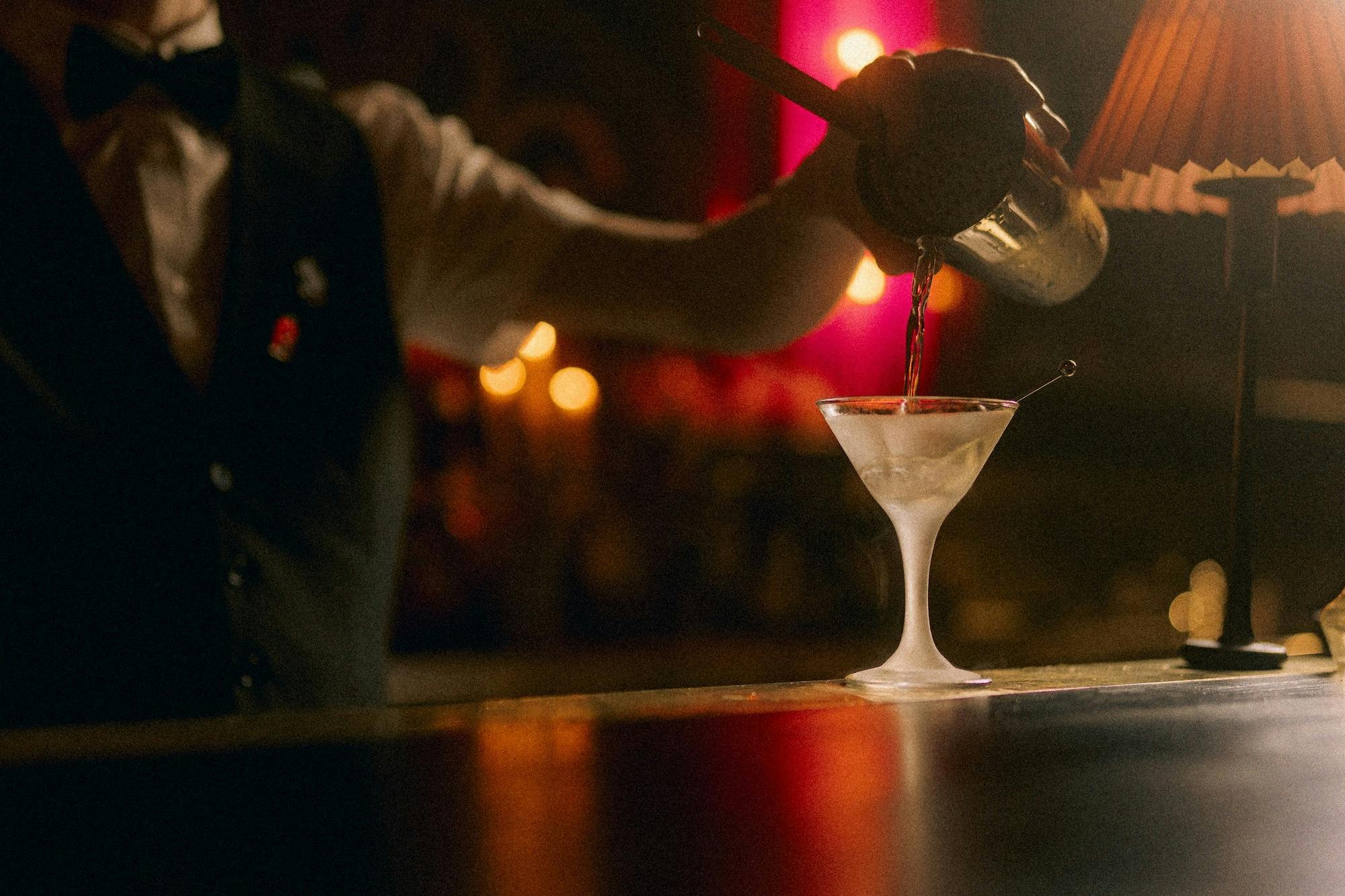 Bartender pouring the Bridge Martini