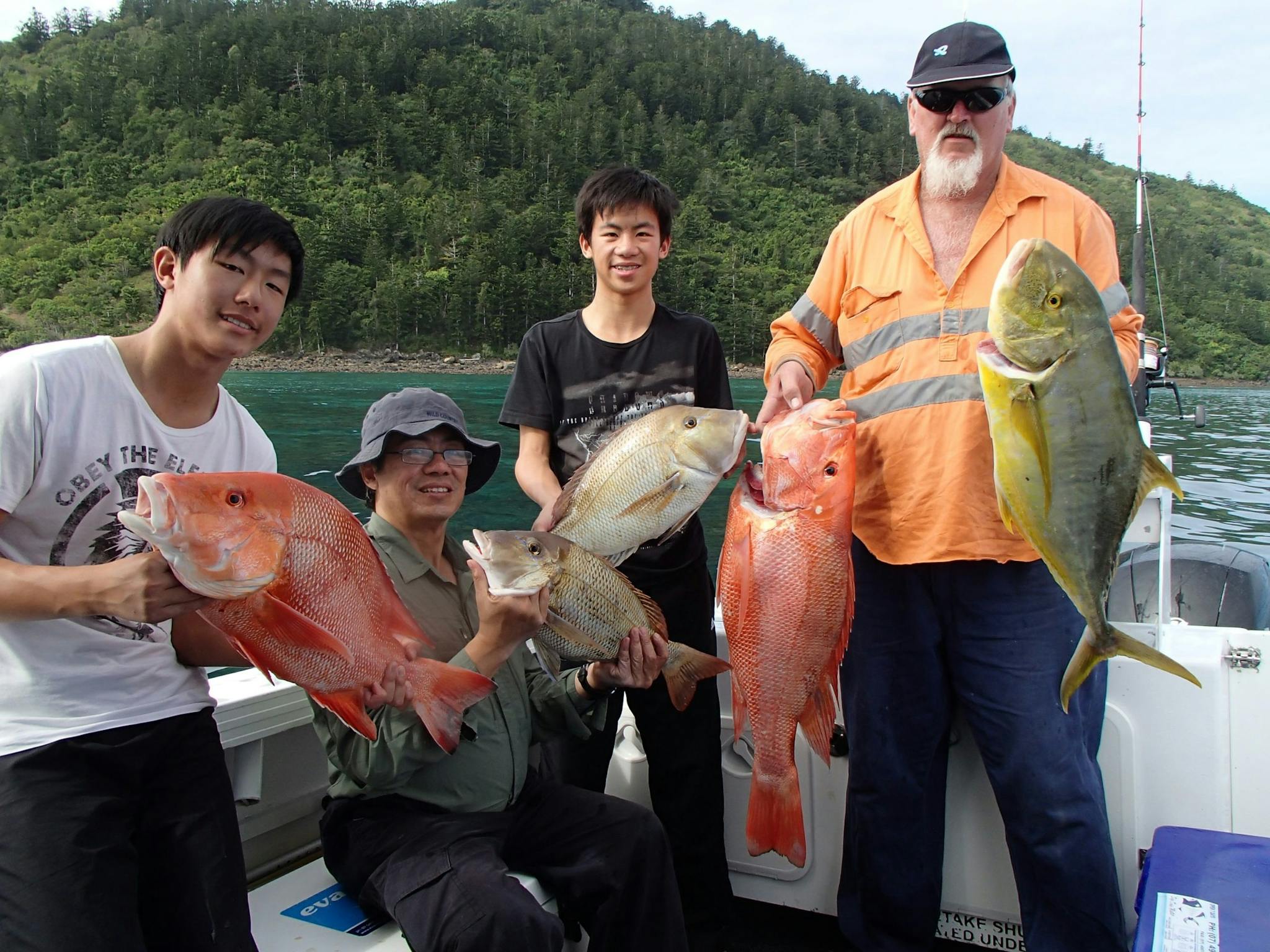 4 anglers holding their catch of the day. Red throat Emperor 4 anglers holding their catch of the day. Red throat Emperor