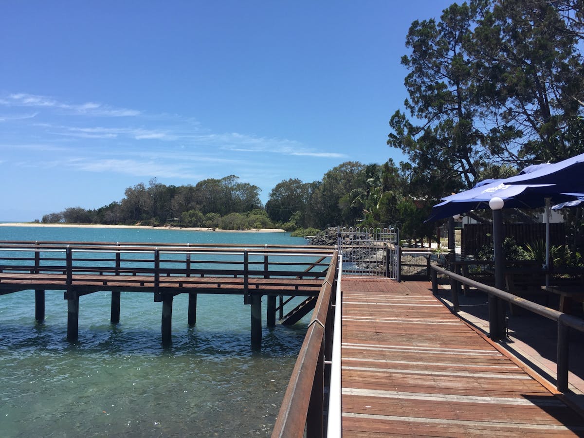 photo showing small pier and walkway at Toogoom at high tide