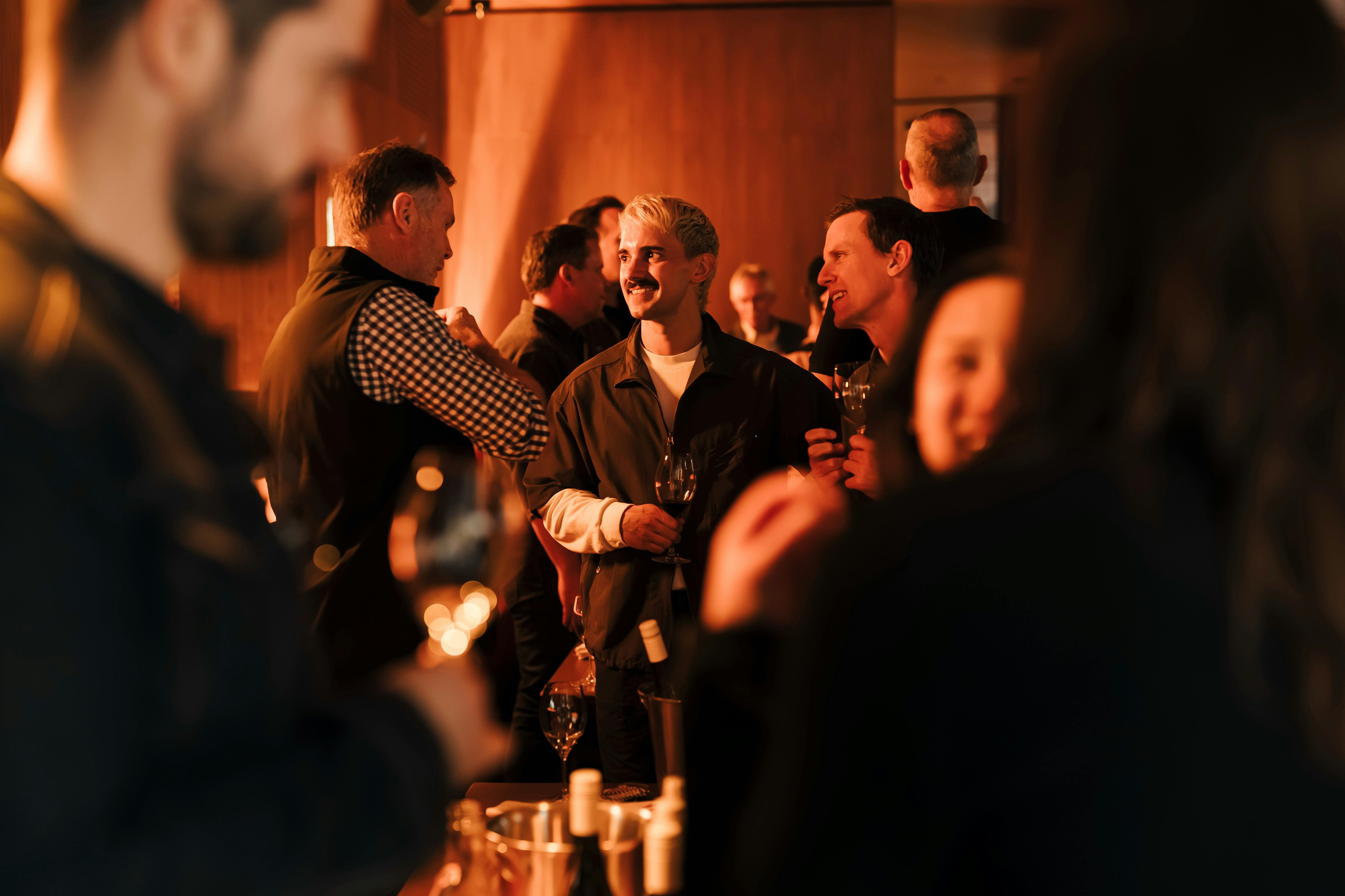 people tasting wine