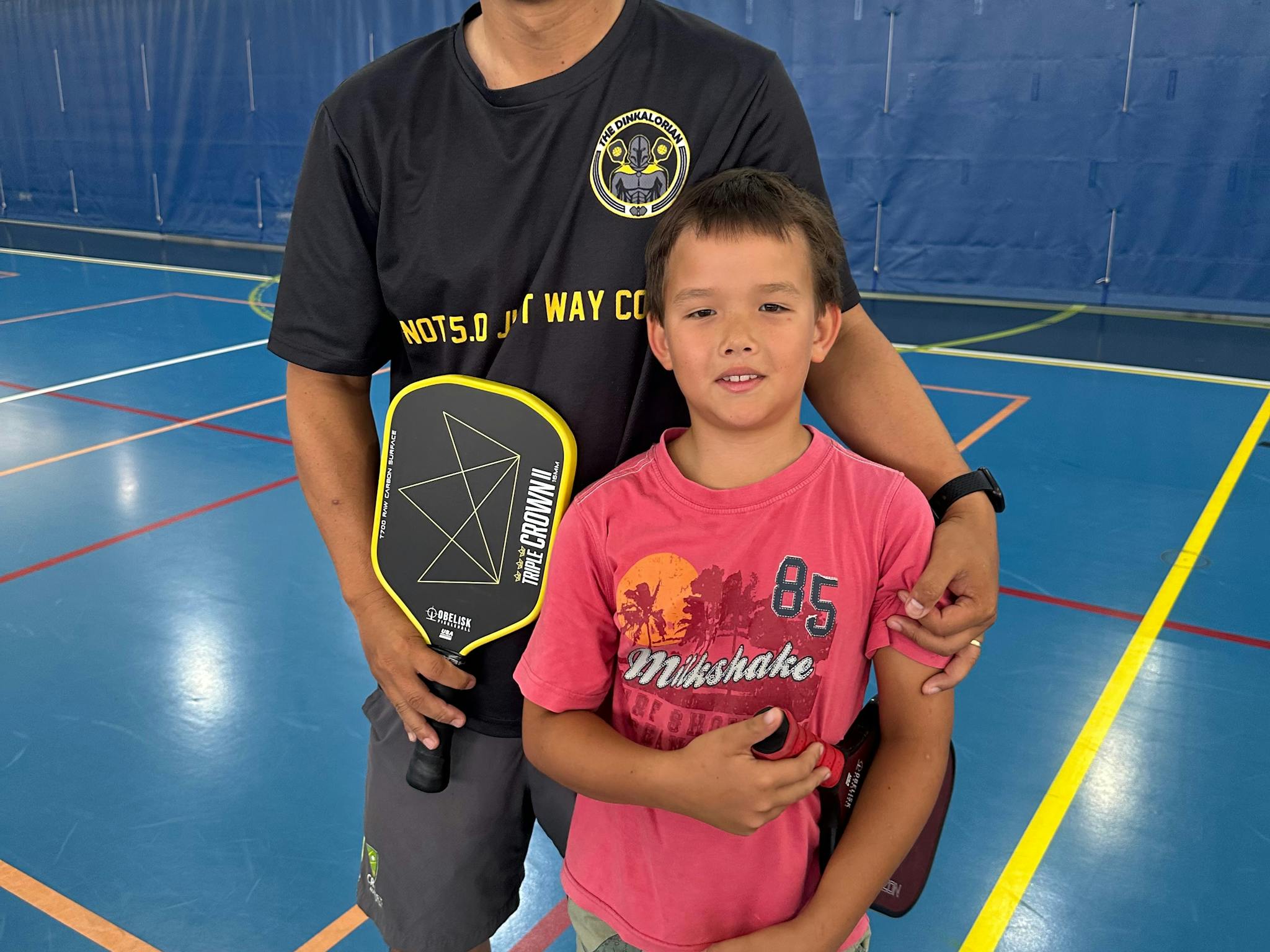 Chen and son playing Pickleball