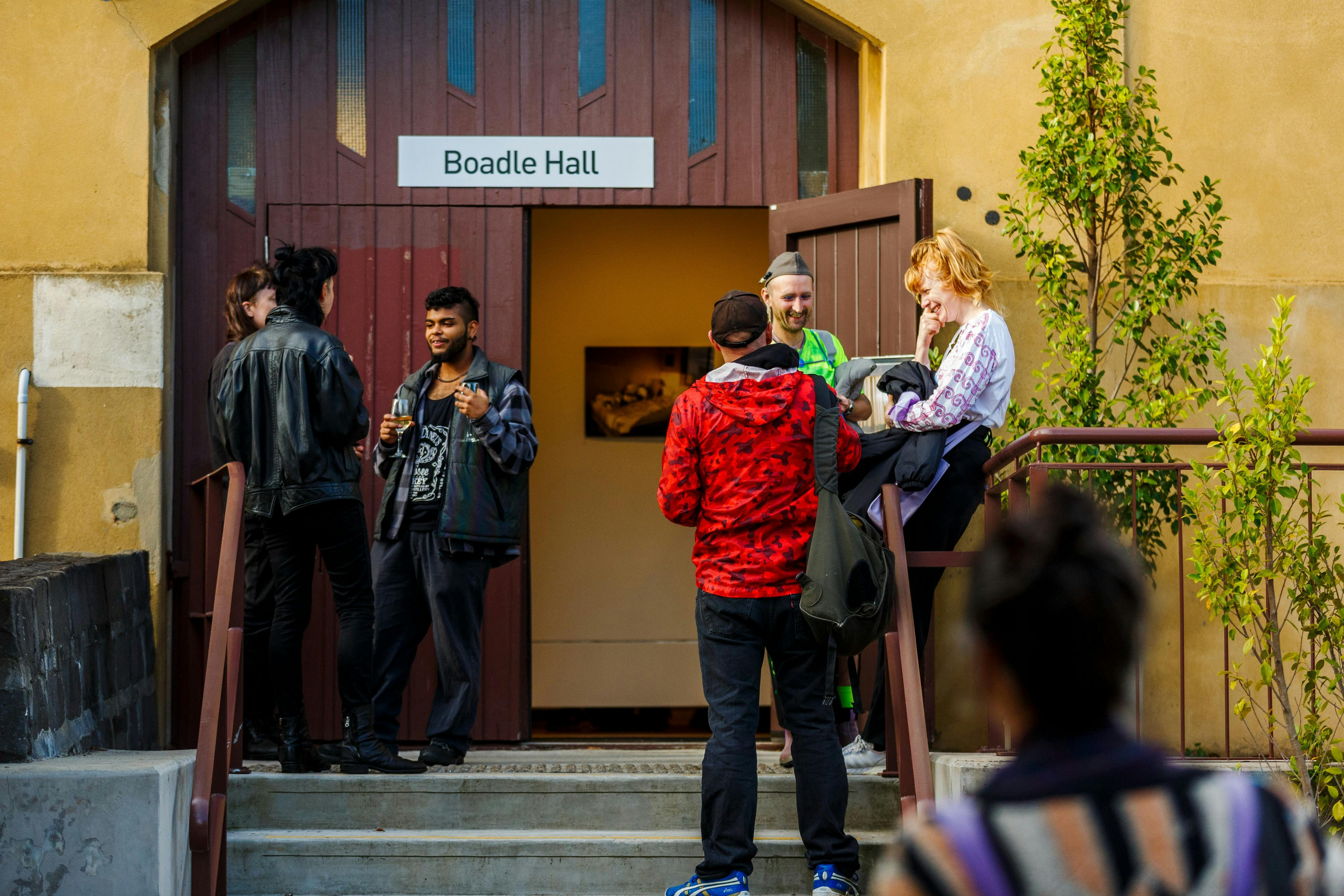 People enjoying exhibition opening outside Boadle Hall